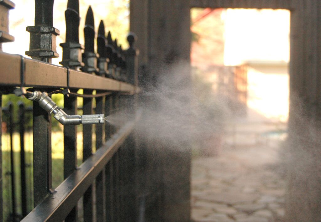 Mosquito misting system protecting a backyard